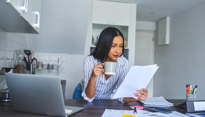 woman-sipping-coffee-learning-working